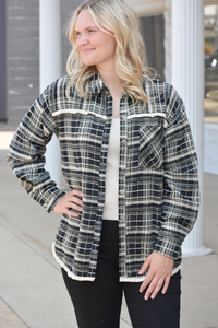 Black plaid flannel shacket with fringe edge